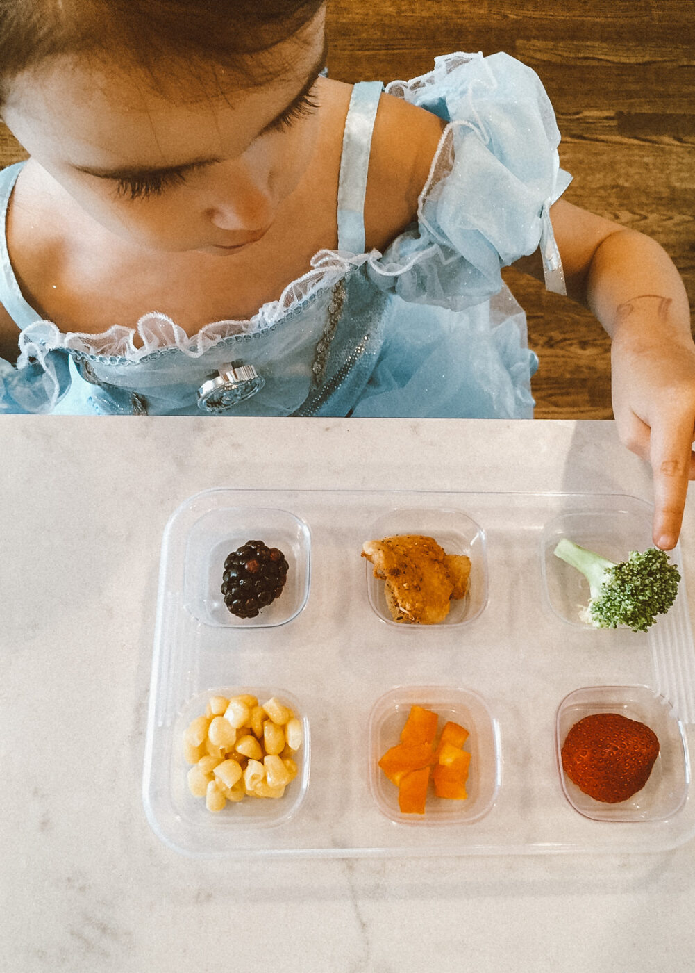 Toddler portions can be quite small. Offering small bites of food at a time can be less daunting for kids exploring new foods. Offering options also let's picky eaters - pick!